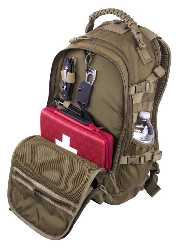 Olive green Elite Survival Systems PULSE 24-Hour backpack with external pockets, a red first aid kit, water bottle, and various tools attached.
