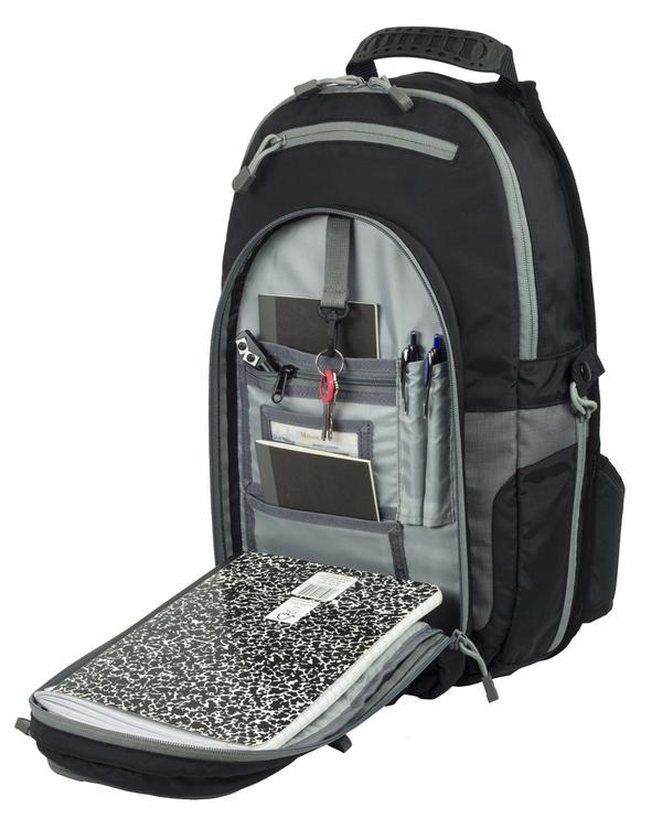 Open Elite Survival Systems black and gray sling backpack showcasing its various compartments filled with school supplies like pens, a notebook, and a calculator, including a concealed handgun compartment.