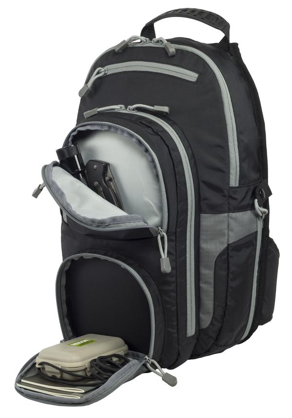 An Elite Survival Systems Gen II Smokescreen Backpack in gray and black with multiple compartments partially unzipped, revealing a laptop, mouse, and headphones inside.