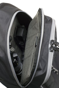 Thumbnail for Open Elite Survival Systems Stealth Covert Operations backpack showcasing a DSLR camera and a lens, set against a white background.