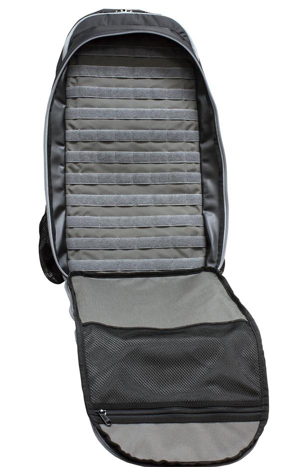 Open Elite Survival Systems STEALTH Covert Operations Backpack with multiple padded compartments and a mesh pocket on the inside of the flap, designed as a discreet rifle backpack, isolated on a white background.