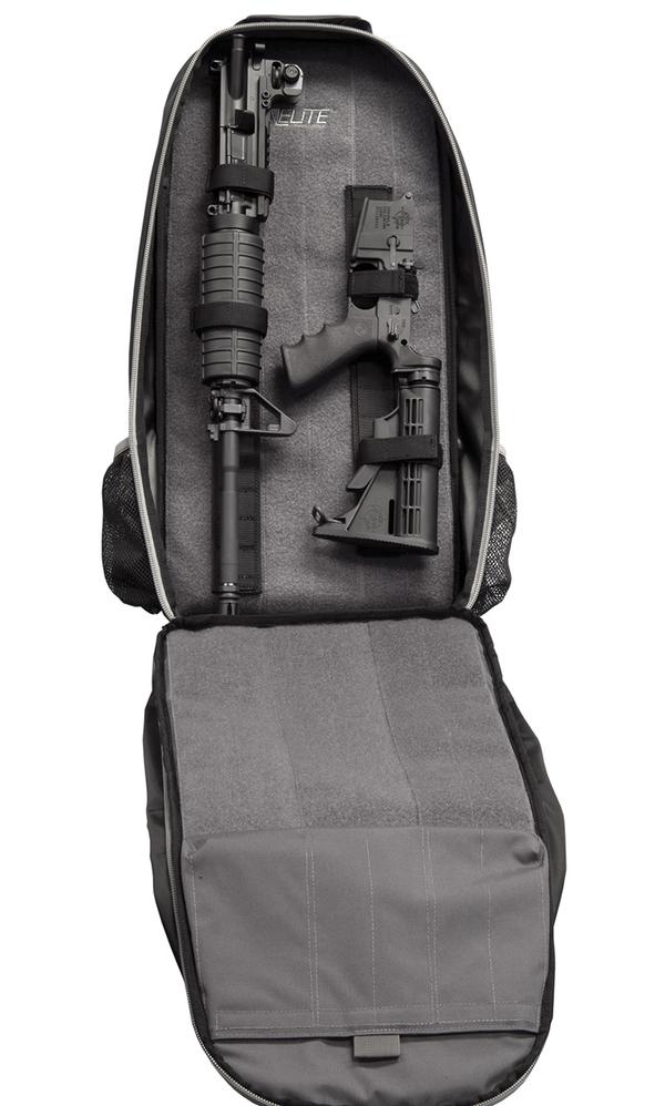 Backpack with compartments holding a disassembled rifle and two handguns, displayed on a gray background, is an Elite Survival Systems STEALTH Covert Operations Backpack.