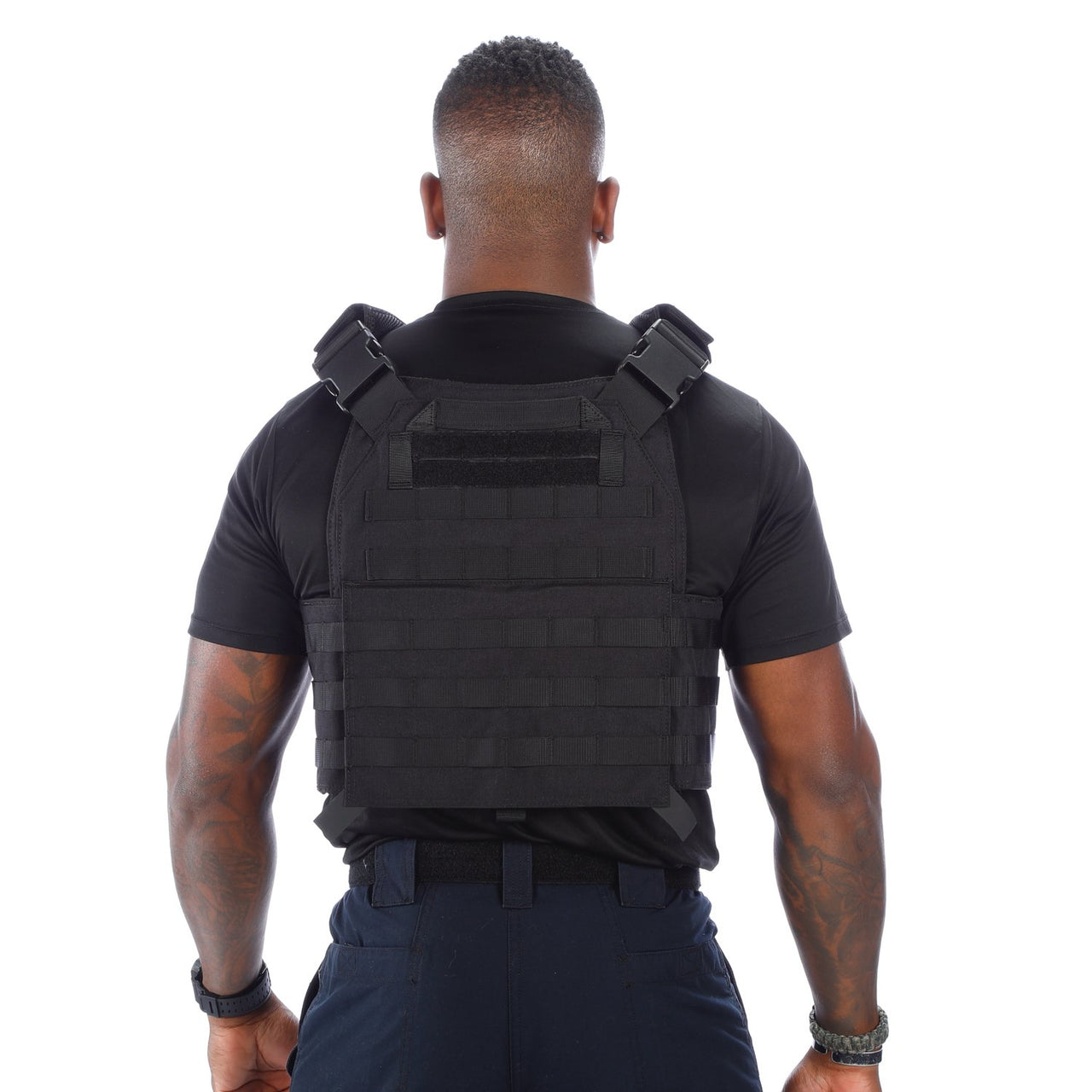 The back view of a man wearing a Body Armor Direct Advanced Body Armor Plate Carrier with Cummerbund.