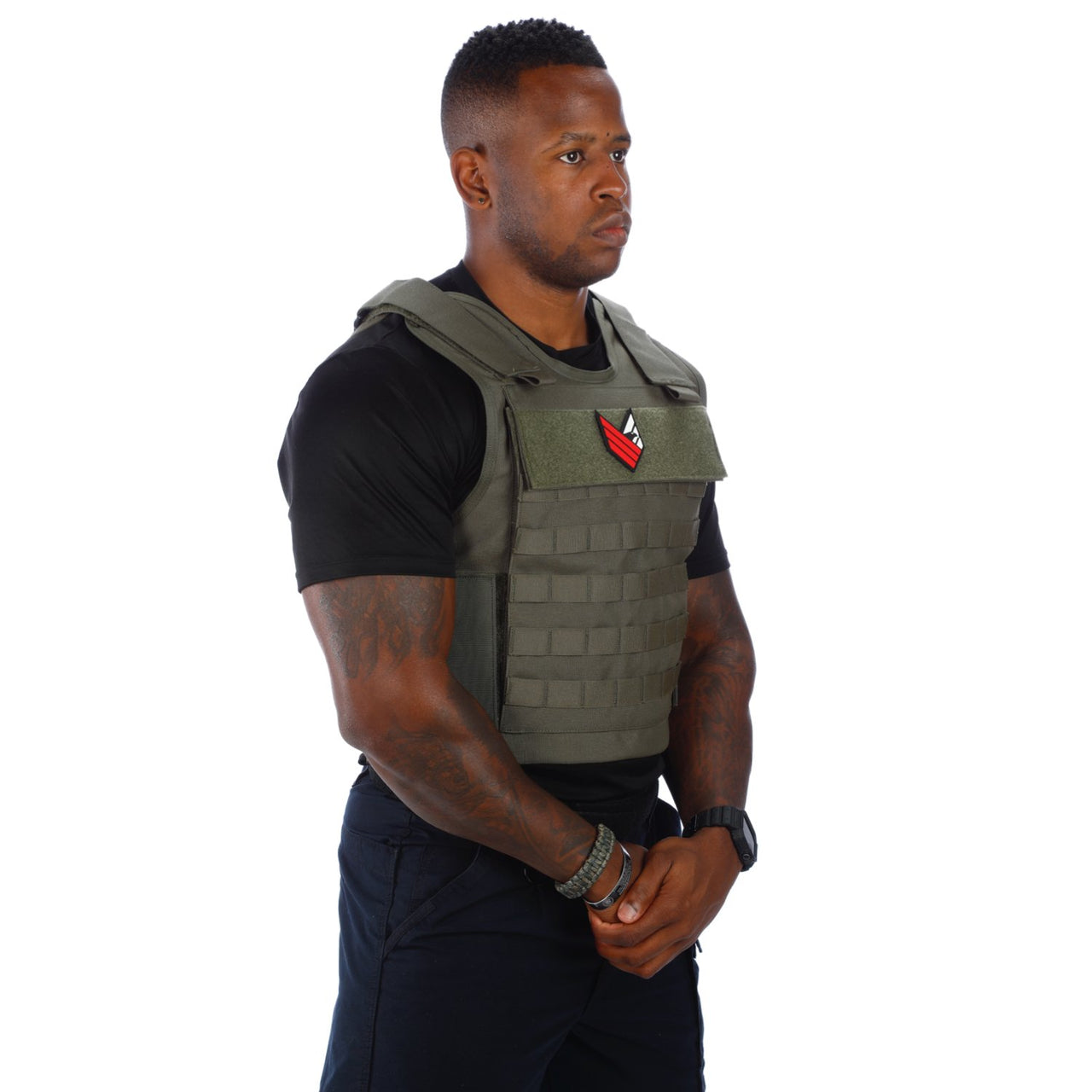 A man wearing the Body Armor Direct All Star Tactical Enhanced Multi-Threat Vest in front of a white background.