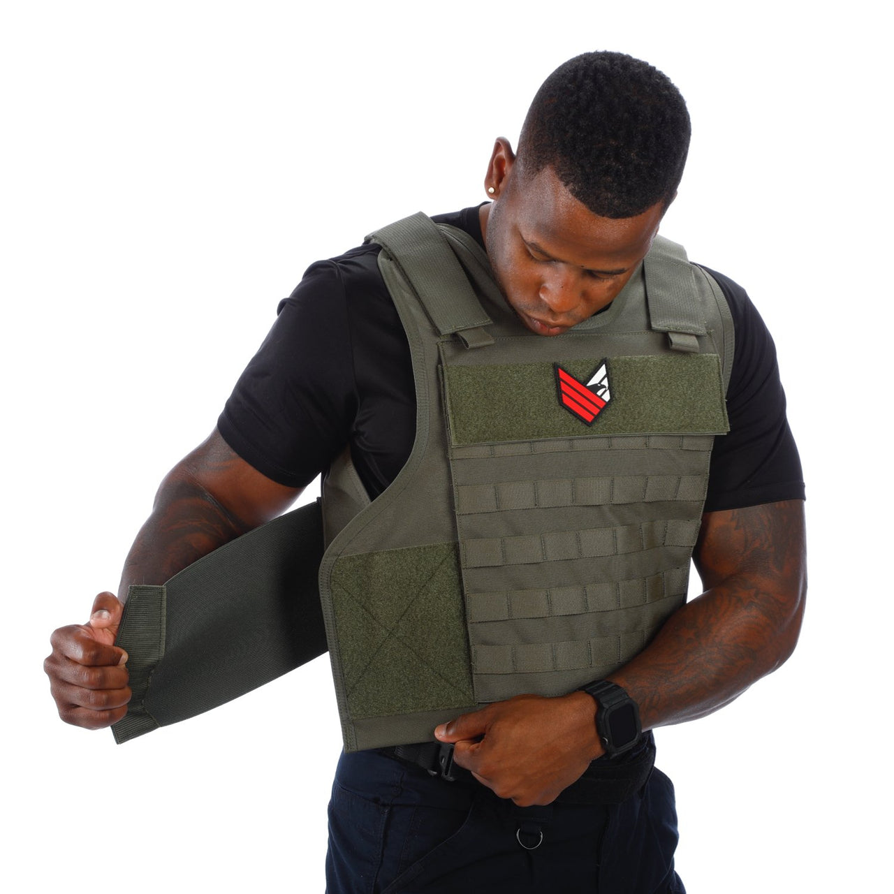 A man wearing a green Body Armor Direct All Star Tactical Enhanced Multi-Threat Vest.