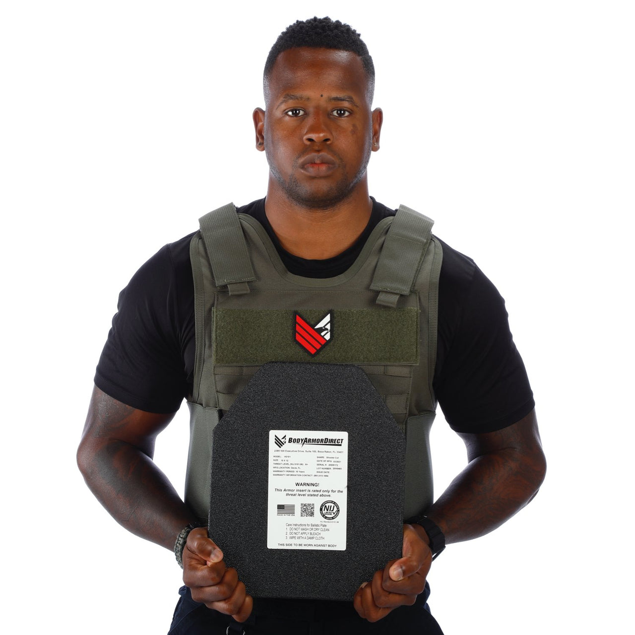 A man holding a Body Armor Direct All Star Tactical Enhanced Multi-Threat Vest in front of a white background.