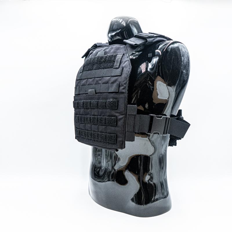 Black and white marble mannequin torso displaying a National Body Armor advanced body armor plate carrier with multiple pouches and straps on a white background.