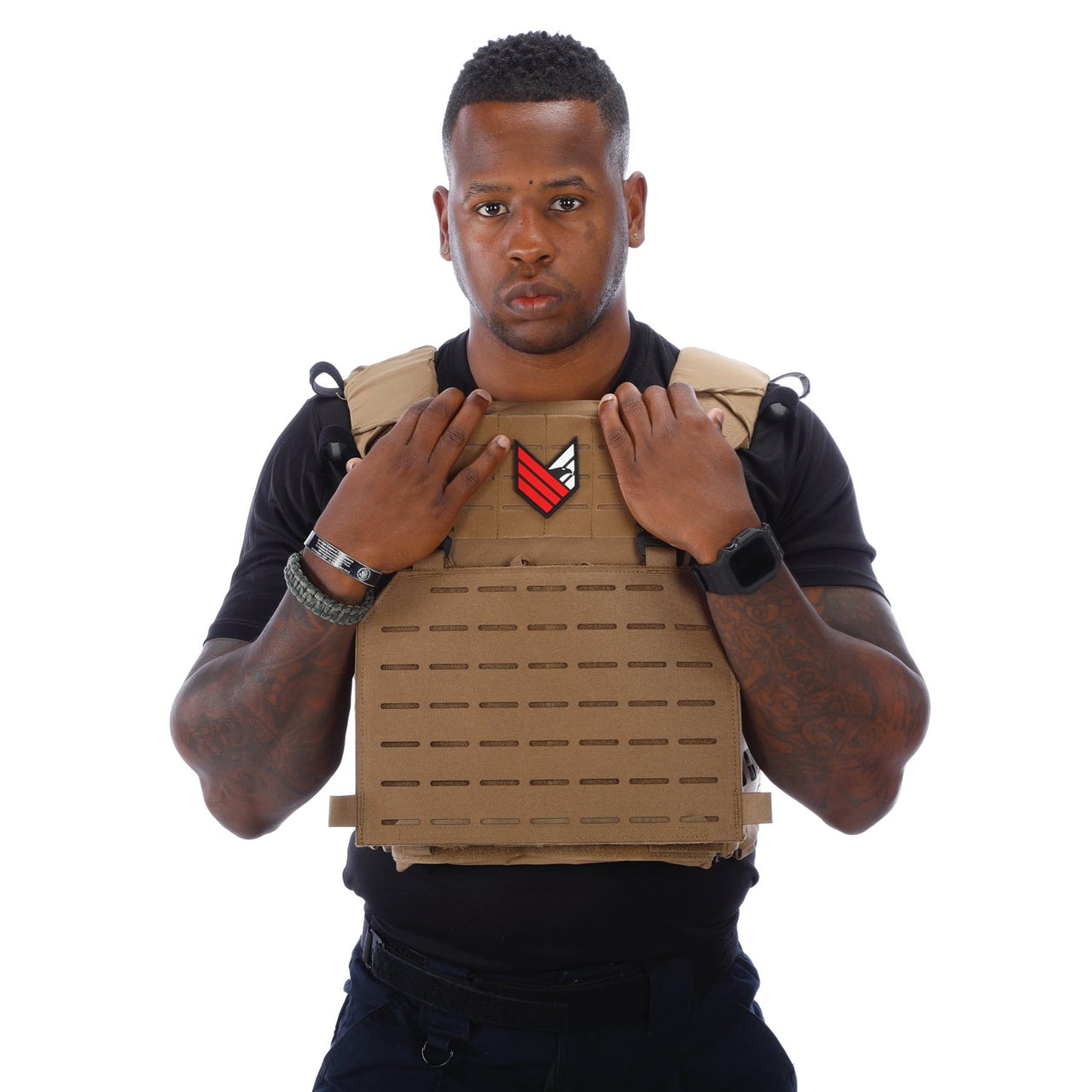 A man wearing a Body Armor Direct Expert Plate Carrier on a white background.