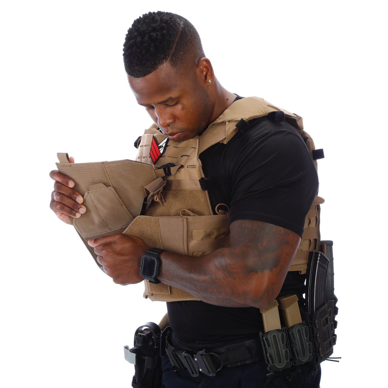 A police officer looking at a Body Armor Direct Expert Plate Carrier made by Body Armor Direct.