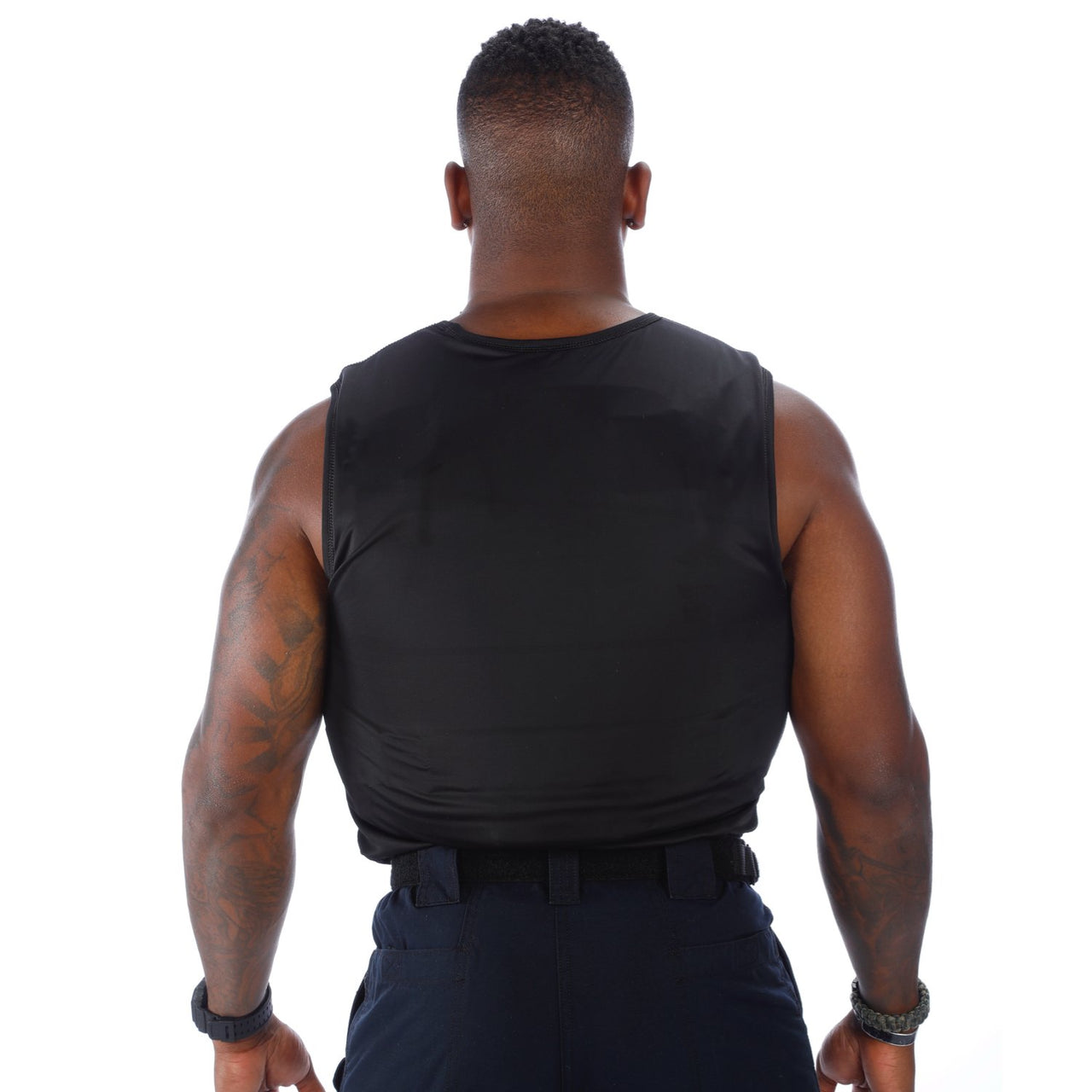 The back view of a man wearing a Body Armor Direct VIP T-Shirt Concealable Enhanced Multi-Threat.