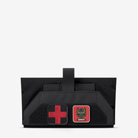 Thumbnail for An AR500 Armor Empty Small of Back IFAK pouch with a red cross on it.