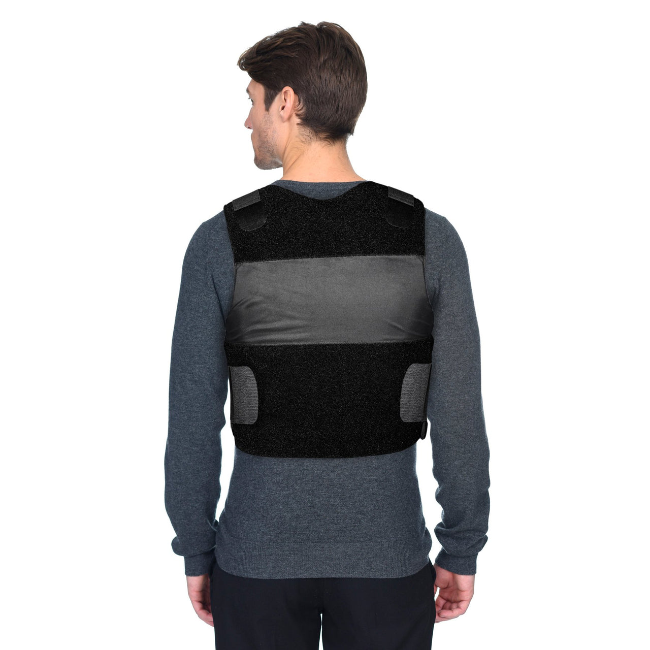The back of a man wearing a Body Armor Direct Freedom Concealable Carrier vest.