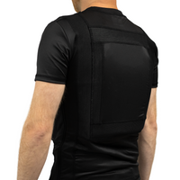 Thumbnail for Side view of a black concealable soft body armor t-shirt worn by a man on a white background