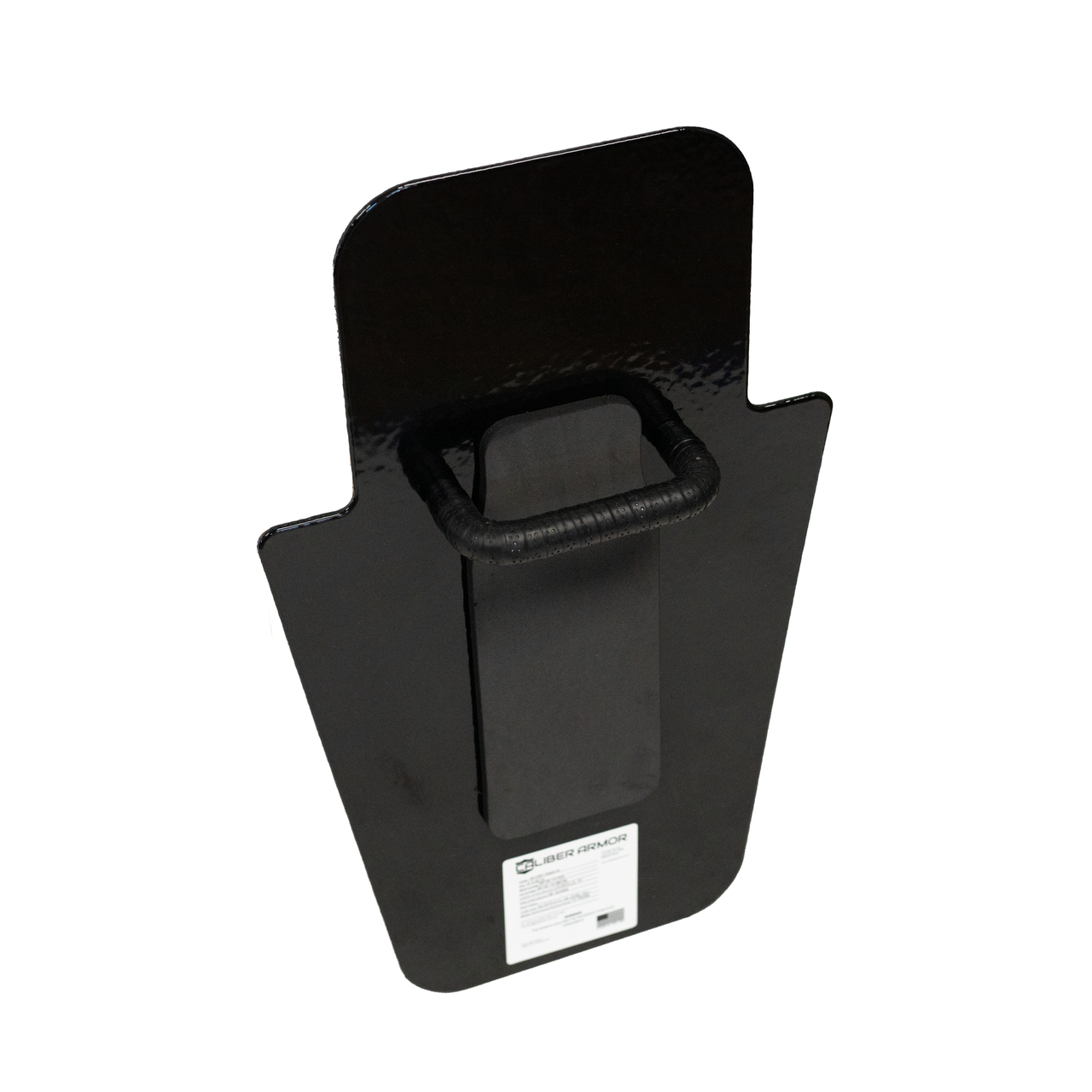Close up of back of black 15" x 25" Caliber Armor Pistol rated Level IIIA HG2 Ballistic Shield with fixed value line handle in the center on a white background