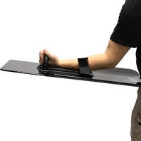 Thumbnail for Person holding a black bullet proof shield with thier arm through the velcro retention strap & grabbing the wrapped handle on a white background
