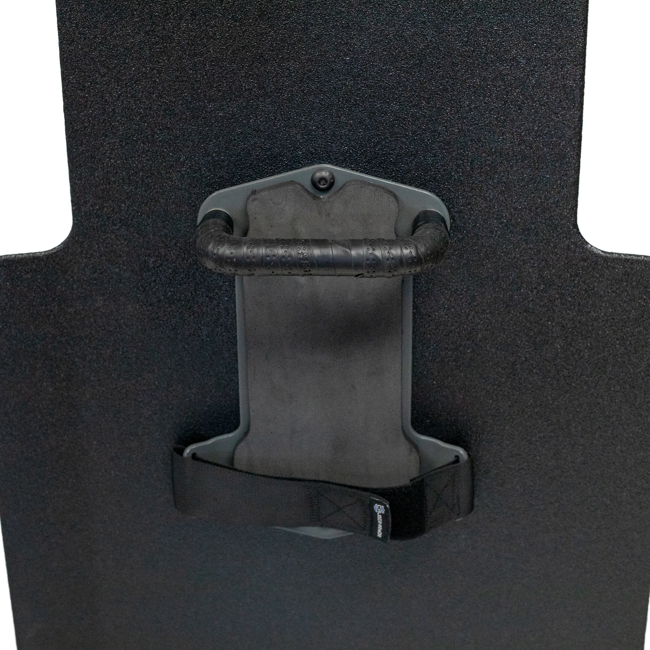 Upclose view of black 20" x 30" Caliber Armor Pistol rated Level IIIA HG2 Ballistic Shield with fixed streamlined handle in the center, padded armrest & quick release strap on a white background