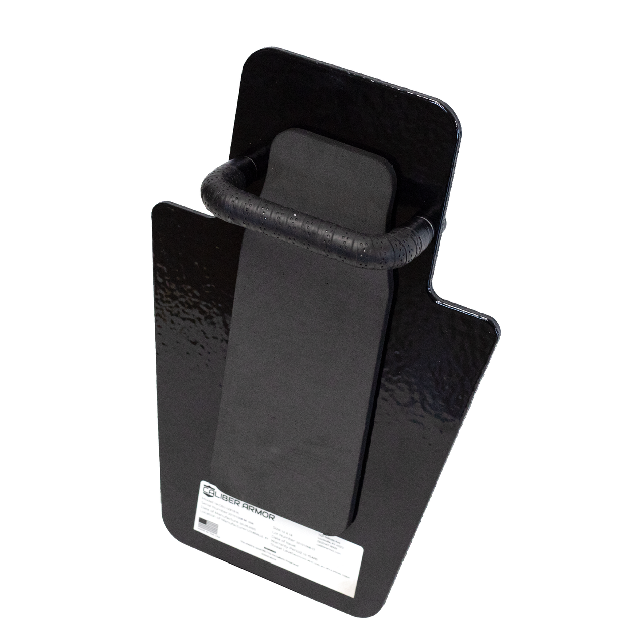 The Caliber Armor ULTRA Series III+ RF2 Shield 12X18 VL MINI is a black, rectangular steel shield with a handle and front label, designed by Caliber Armor to offer durability akin to a ballistic shield.