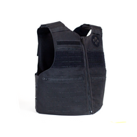 Thumbnail for The Caliber Armor CaliberX Patrol Vest Soft Armor Package - NIJ Level IIIA/HG2 features a black tactical design with front zipper, multiple pockets, and Velcro patches for soft body armor inserts, shown on a white background.