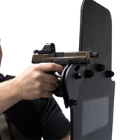 Thumbnail for Hand holding a handgun against a black protective shield using the bolt on gun support bracket on a white background
