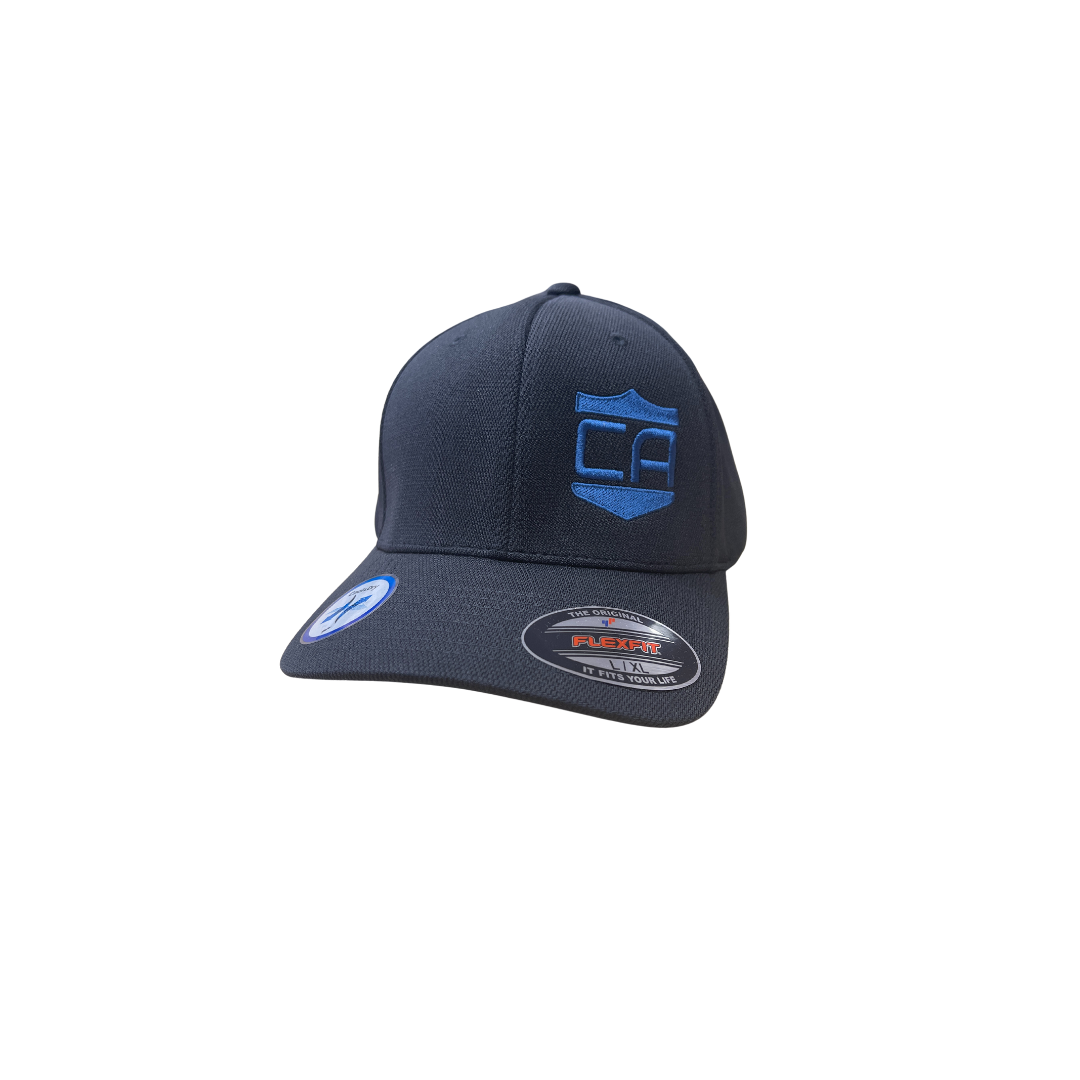 The Caliber Armor Hat by Caliber Armor features a dark blue color with a blue shield and letter design on the front, plus a Flexfit sticker on the brim—a stylish way to show your support.