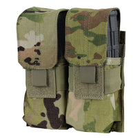 Thumbnail for The Caliber Armor Double M4 Mag Pouch is MOLLE compatible, made from camouflage fabric, and features two flap-and-Velcro secured pockets for AR/M4 magazines.