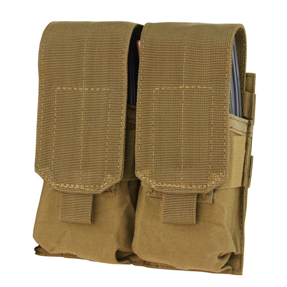 The Caliber Armor Double M4 Mag Pouch is a tan, durable fabric pouch with flap covers that securely holds two AR/M4 mags side by side. MOLLE compatible for easy attachment to your tactical gear.