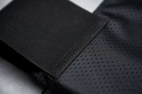 Thumbnail for Close-up of black, textured, and perforated fabric with visible stitching detail from the Caliber Armor CaliberX IIIA Gray Man Concealable Package, designed for discreet soft armor panel carry.