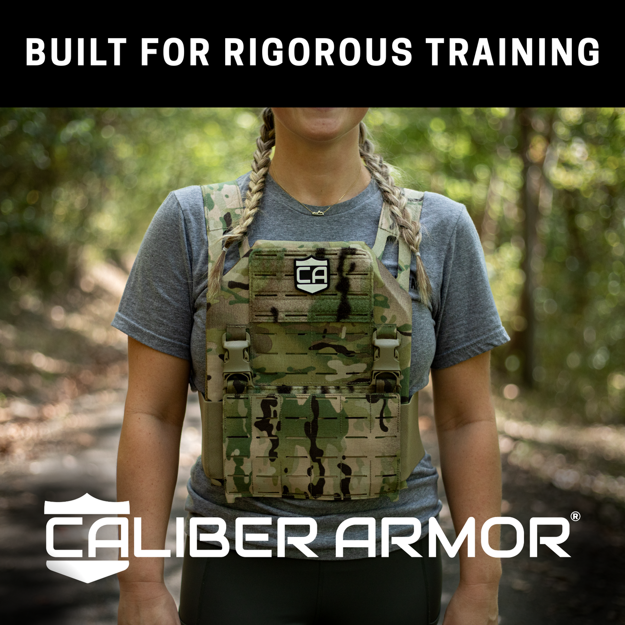 Female wearing a camouflaged armor vest with 'Caliber Armor' branding in a forest setting. the weighted plates that are installed in the vest are for fitness and endurance training