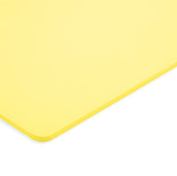 Thumbnail for A close-up of the corner of a rectangular yellow cutting board with rounded edges on a white background, featuring superior impact absorption inspired by Caliber Armor's Extreme Impact Trauma Pad - Side Pads.