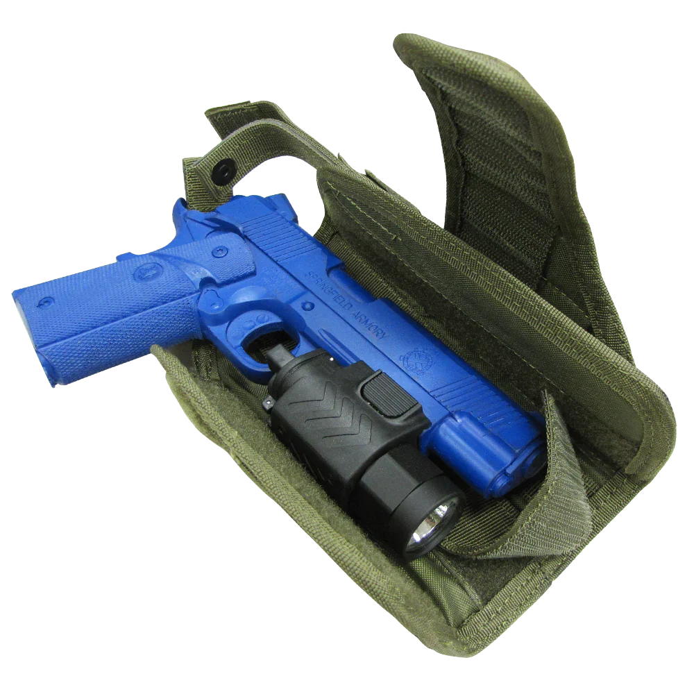 A blue training pistol with a laser flashlight mount sits inside an open green Caliber Armor HT Holster.