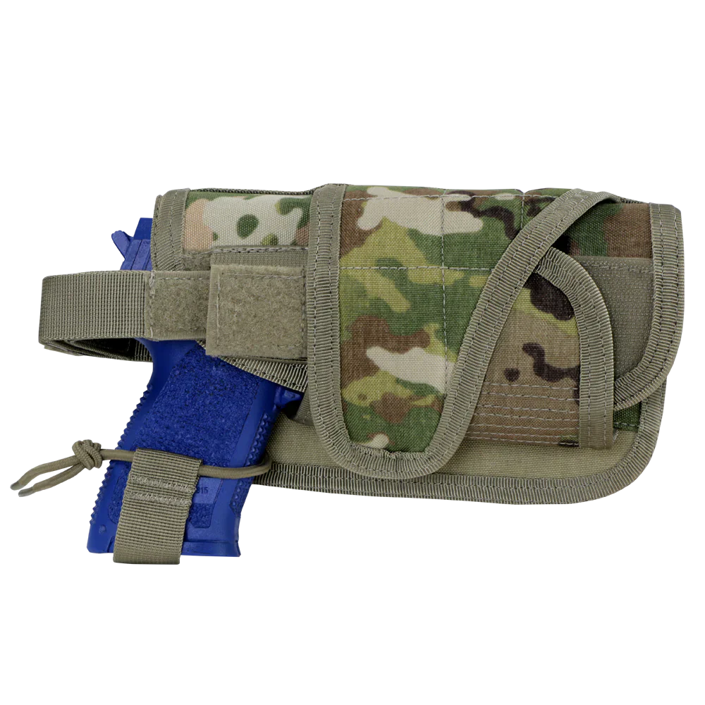 A blue training pistol is partially inserted into a Caliber Armor HT Holster, featuring a camouflage pattern and Velcro straps.