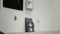 Thumbnail for Level IIIA Ballistic shield against a white brick wall placed next to AED & other emergency response or active shooter protective gear