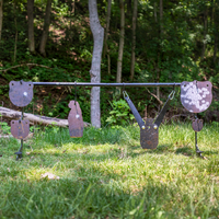 Thumbnail for The Double Tap Industries Hook Spiked Ground Stand offers durable target hanging for metal shooting targets outdoors on grass, with trees providing a scenic background.