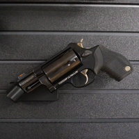 Thumbnail for Black revolver barrel mounted on a carbon fiber rod, shown hanging from our Assault Wall tactical slat wall panel, black plastic mount with carbon fiber rod is universal and fits most pistols