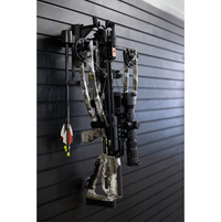 Thumbnail for black plastic hanger for vertically hung crossbows shown mounted to a black tactical gear slat wall named Assault Wall