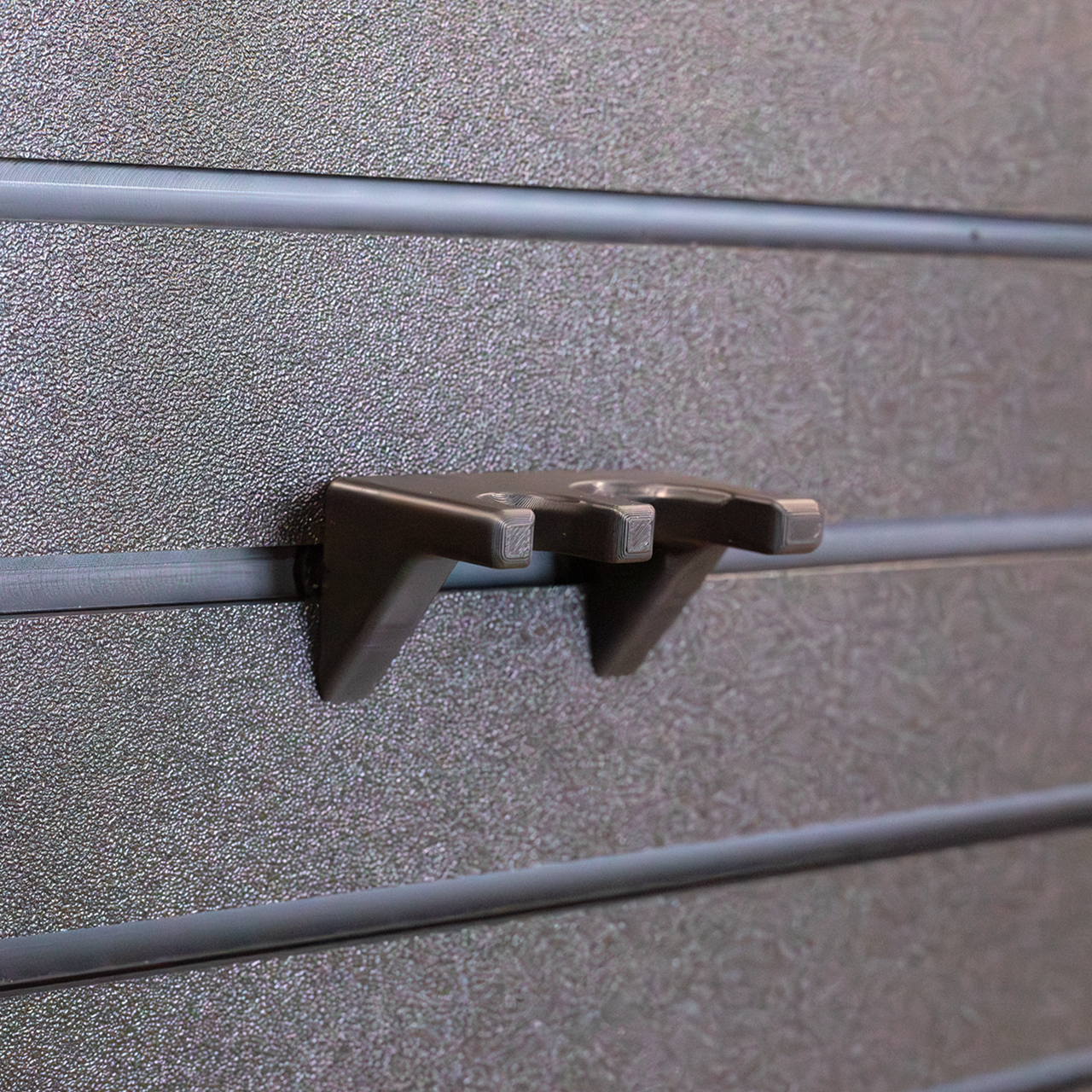 Tactical flashlight wall hanging mount, 2 flashlight capacity shown hanging from out Assault Wall tactical slat wall
