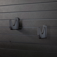 Thumbnail for View of two hook hangers that have been mounted at two different heights to accomidate long guns or pistols on the Assault Wall tactical slat wall panel