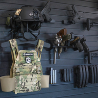 Thumbnail for Tactical gear including a helmet, vest, magazines, and weapons mounted on the Assault Wall tactical slat wall panel wall system.