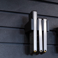 Thumbnail for Black pistol magazine hanger showing three 45 cal magazines installed on the mount and hung on an Assault Wall tactical slat wall panel, 3 magazine capacity