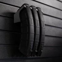 Thumbnail for Three black AK-47 magazines stacked on mag slat wall hanger, installed on an Assault Wall tactical slat wall