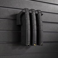 Thumbnail for Three black AR-15 magazines stacked on mag slat wall hanger, installed on an Assault Wall tactical slat wall