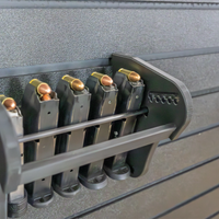 Thumbnail for Assault Wall Universal Mag Holder with adjustable tension, shown loaded with pistol mags organized & mounted to a black Assault Wall panel, highlighting the adjustable slot options that the carbon fiber rod rests in