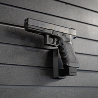 Thumbnail for Left facing black plastic magazine mounted 40 Cal pistol hanger installed on Assault Wall Tactical slat wall