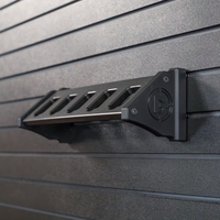 Thumbnail for Black plastic five pistol storage and organization mountthat is installed on a black Assault Wall panel for tactical guns