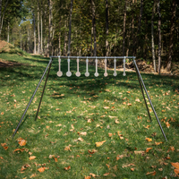 Thumbnail for metal know your limits kyl targets assembled on conduit alternativer quick stand kit legs and crossbar in a wooded setting