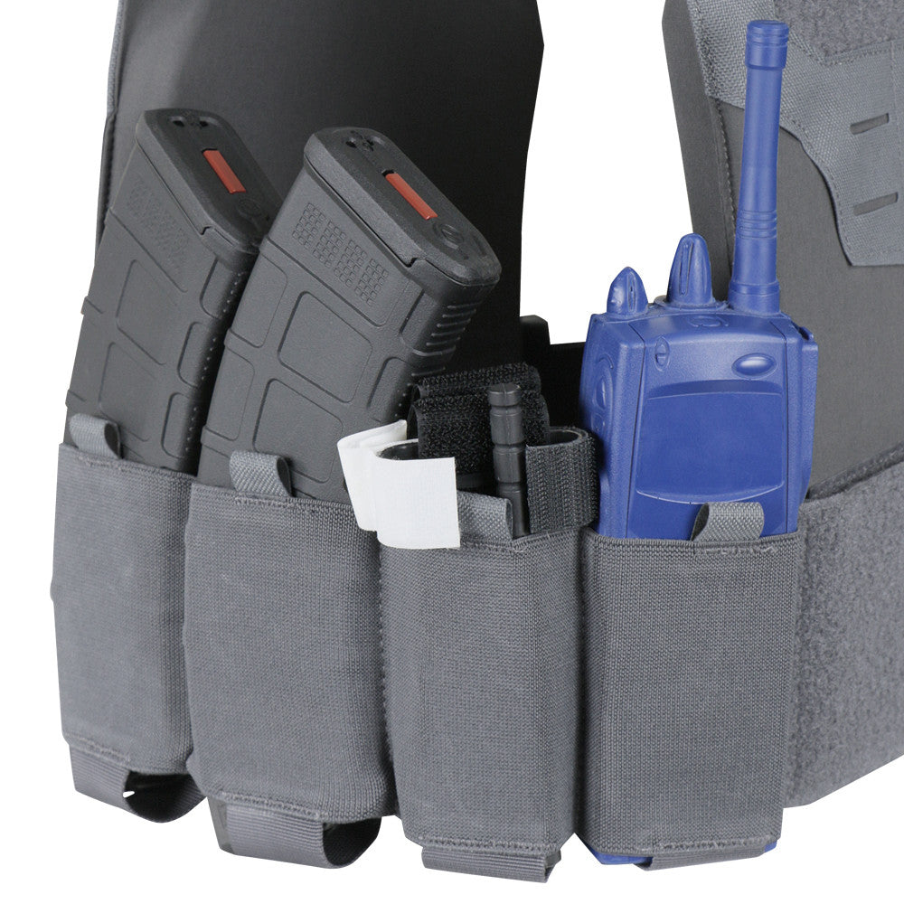 The Caliber Armor Specter Carrier tactical vest features adjustable sizing and reinforced nylon, with pouches for two black rifle magazines, a black marker, a white item, and a blue radio.