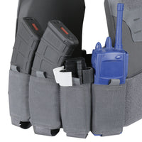 Thumbnail for The Caliber Armor Specter Carrier tactical vest features adjustable sizing and reinforced nylon, with pouches for two black rifle magazines, a black marker, a white item, and a blue radio.