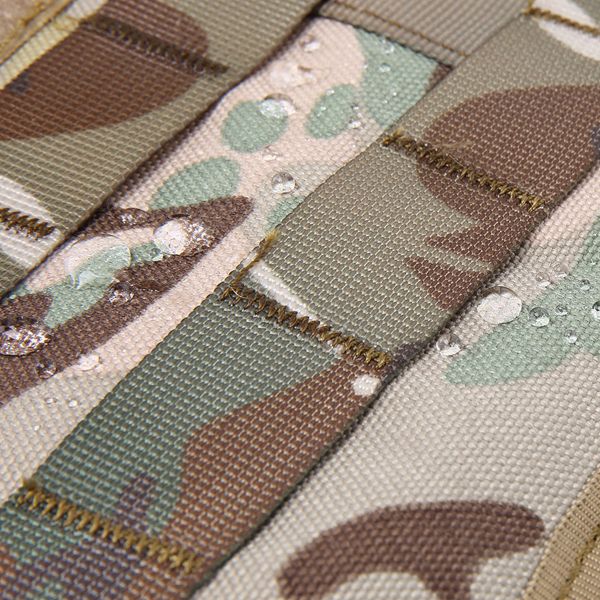 Close-up of water droplets on a Tactical Scorpion Gear - D1 Canine Dog K9 Camo MOLLE Military Training Vest Harness with visible stitching.