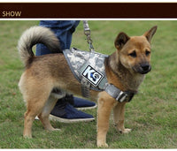 Thumbnail for A dog wearing a Tactical Scorpion Gear D3 Small Canine Dog K9 Camo MOLLE Training Vest Harness stands on a grassy field with a person partially visible in the background.