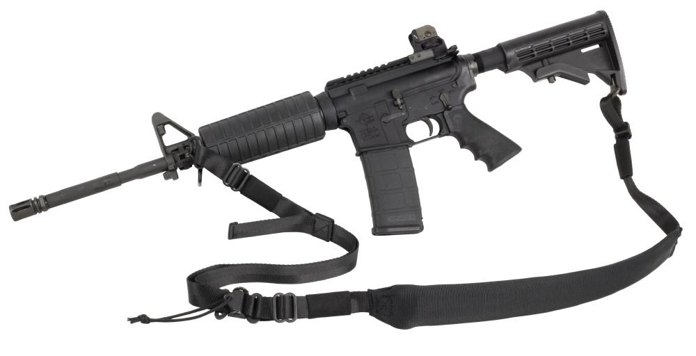 An Elite Survival Systems Rapid-Tac 2-Point Padded Sling, Black with an attached two-point tactical sling and optical sight, isolated on a white background.